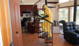 Hazmat technician on stairs in fentanyl house