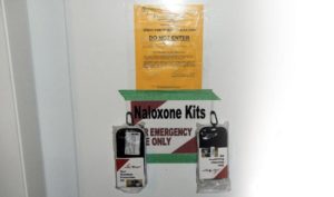 Naloxone kit taped to door at illegal fentanyl operation